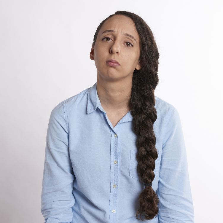 upset woman in front of a wihte background